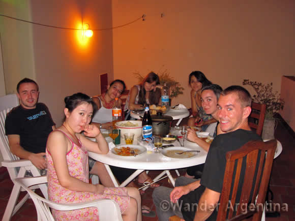A group of young people sharing dinner in a shared house or casa compartida in Buenos Aires