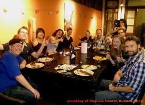 An international group around the dinner table at Rayuela Hostel in Buenos AIres, Argentina